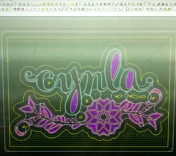 Cynla logo in the program before it's cut into a wooden sign - tech geek image